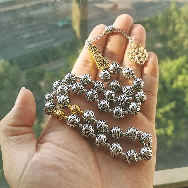 سبحة معدنية لون فضي مع طربزونة ذهبية