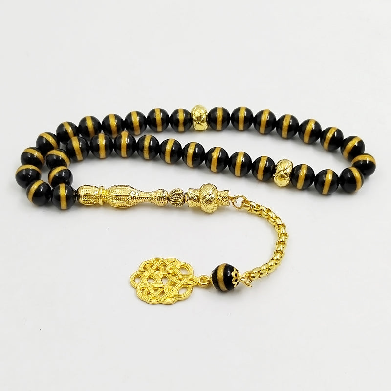 سبحة فخمه عقيق اسود بالمقلم الذهبيه