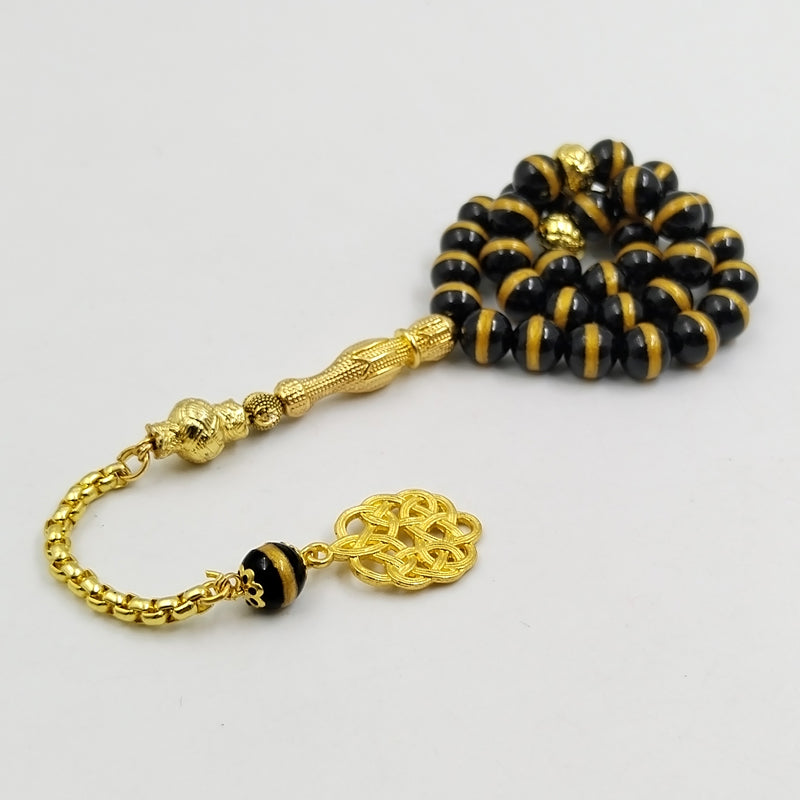 سبحة فخمه عقيق اسود بالمقلم الذهبيه