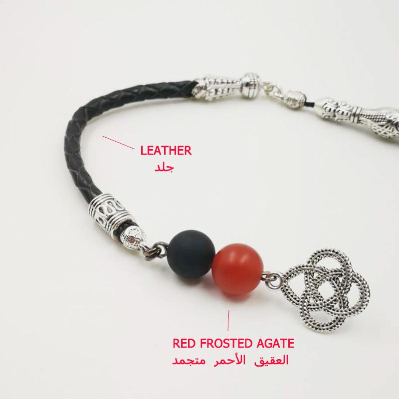 سبحة عقيق اسود مطفي مع حجرعقيق احمر