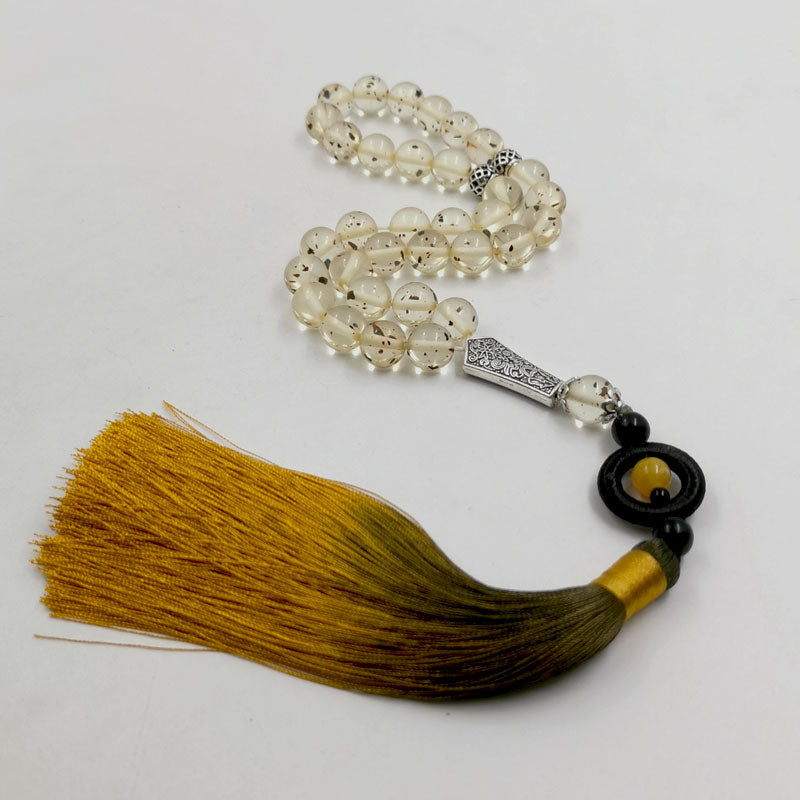 مسبحة مستكة مع شرابة قطن اصفر