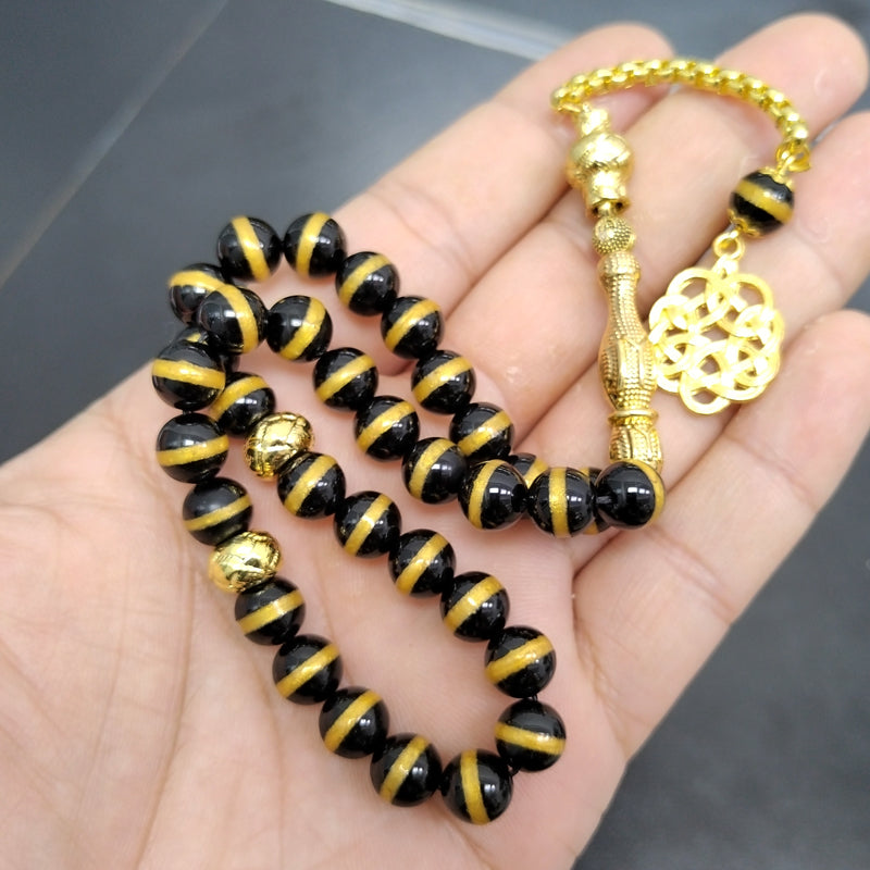 سبحة فخمه عقيق اسود بالمقلم الذهبيه