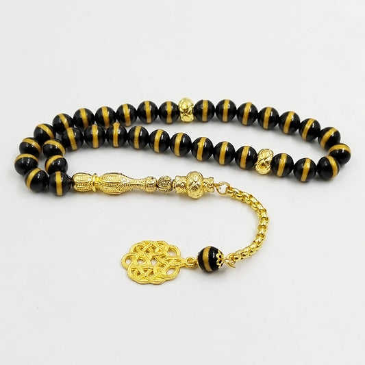 سبحة فخمه عقيق اسود بالمقلم الذهبيه